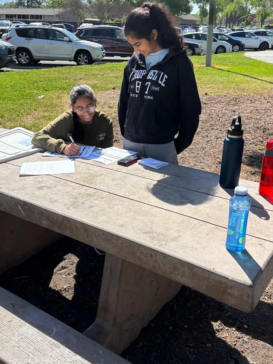 Volunteers signing in at the cleanup check-in table