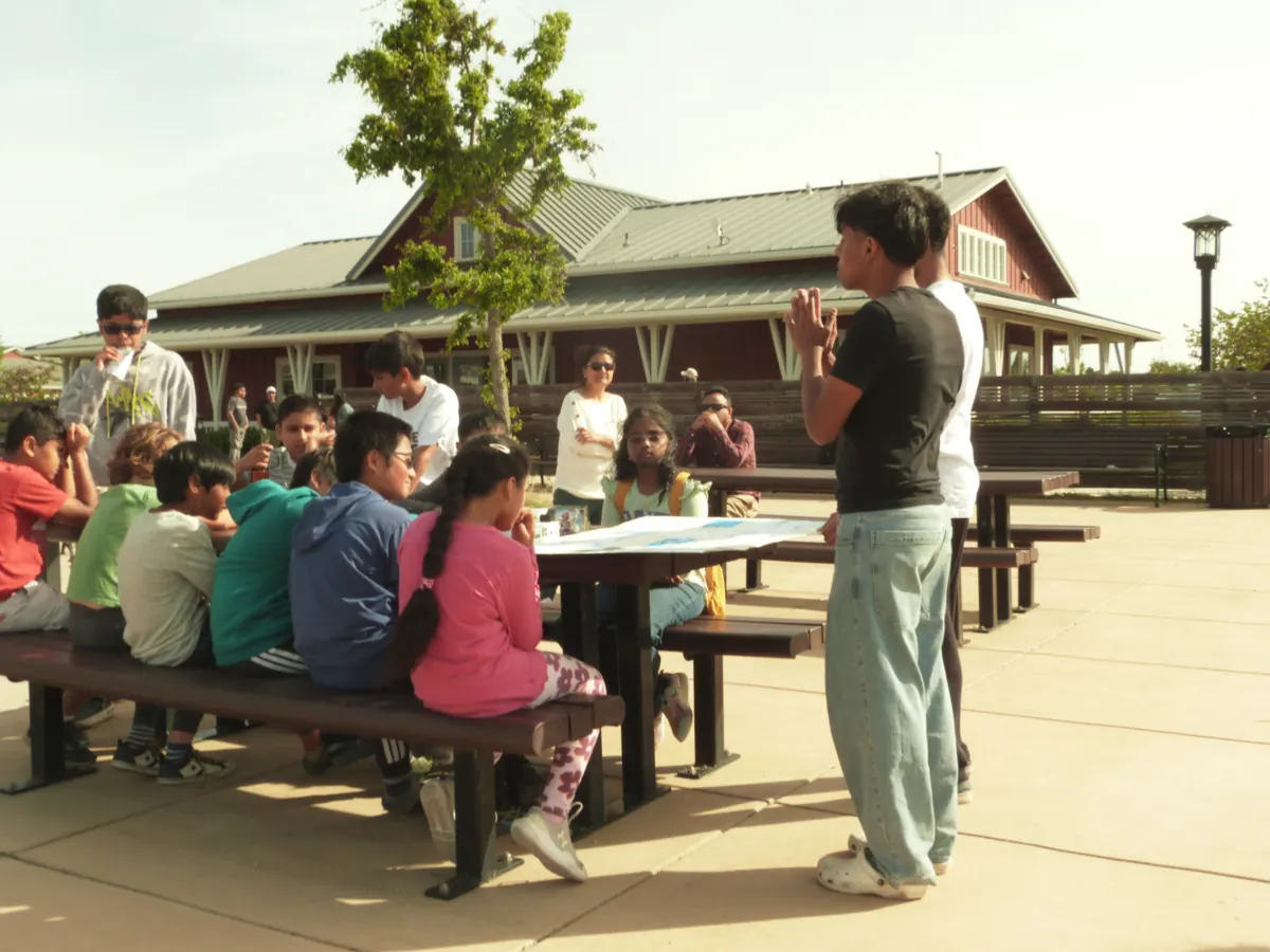Students seated at the station tables during the workshop